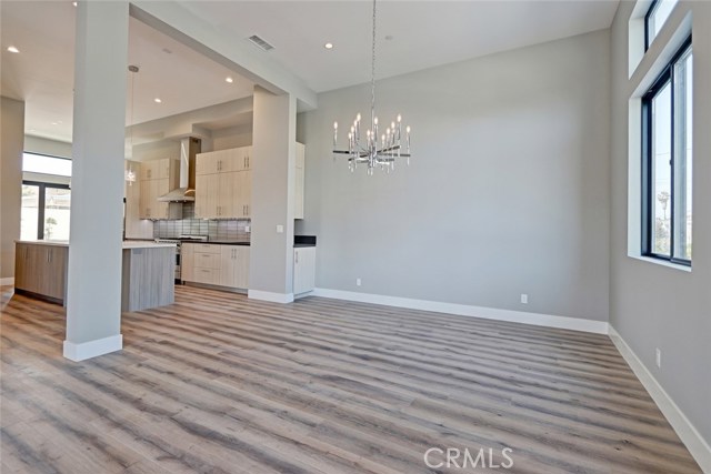 LIVING ROOM LOOKING TO THE DINNING AREA AND KITCHEN