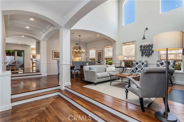 Formal living room has high ceilings to maximize great light