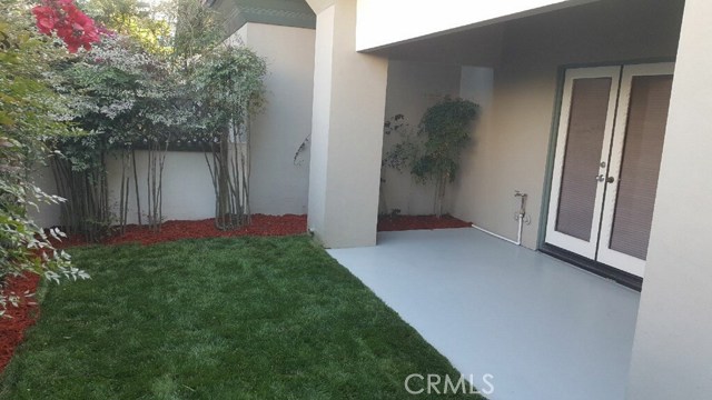 Patio and new sod off downstairs bedroom