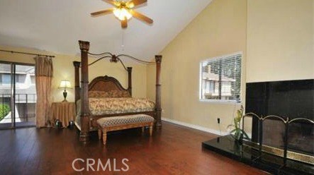 Master bedroom with natural light from the balcony and window. Great fireplace for those cold evenings.
