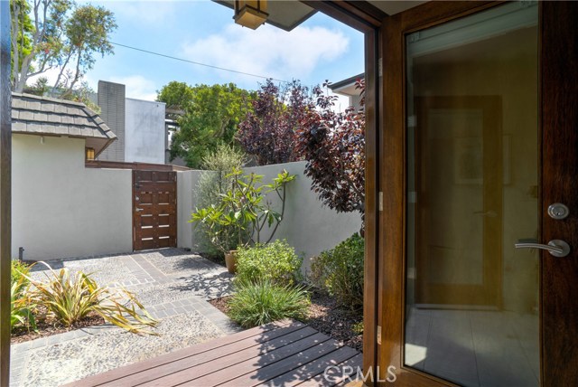 View from double mahogany front doors with smart sidelite for ventilation.