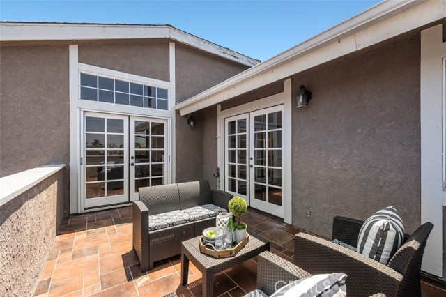 French door lead to living room as well as the primary suite