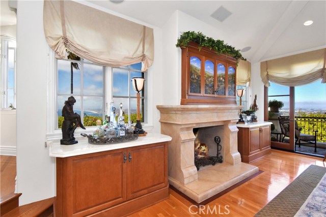 Elegant fireplace in great room with hidden TV above.