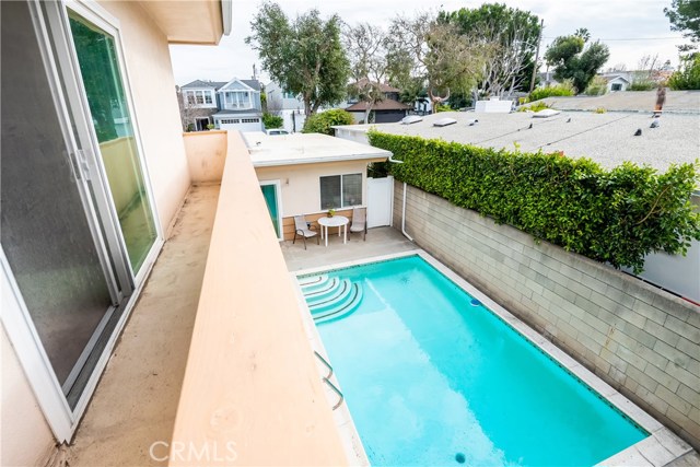 pool view from upstairs balcony off master bedroom