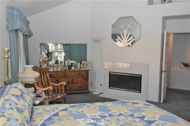 Sitting Retreat Area With Fireplace In The Master Bedroom.