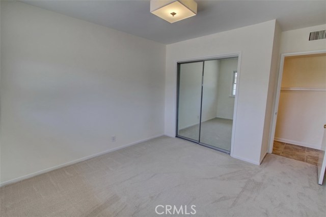 Bedroom 1 with mirrored closet view