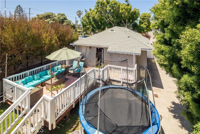 View from upper rear unit to backyard and deck of front house.