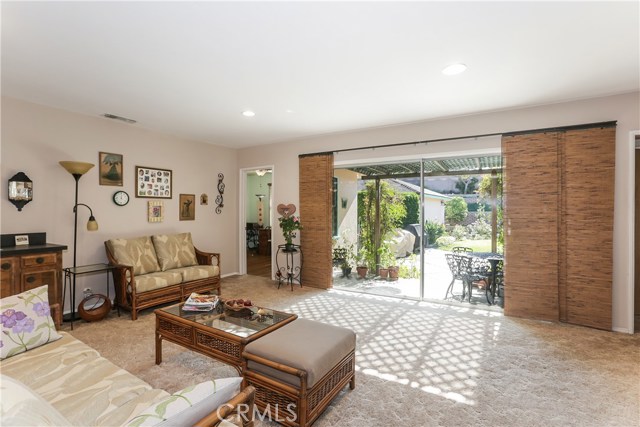 Family Room with sliding glass doors leading to back yard and garage