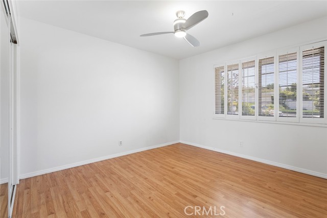 Bedroom 2 with plantation shutters and fan ceiling