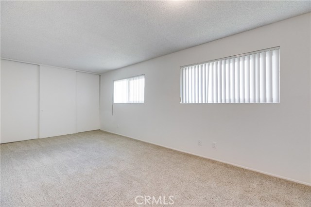 This center bedroom, is extra wide and features 2 doors and 2 closets. It could easily be split into 2 bedroom to create a 5 bedroom home as desired