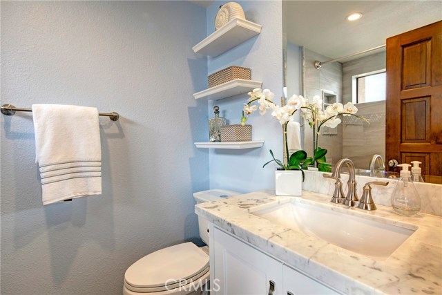 En-suite dual master bathroom with carrera marble countertop, shower, and extra deep tub. En-suite dual master bathroom with carrera marble countertop, shower, and extra deep tub.