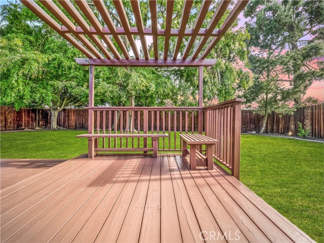 The expansive wood deck is perfect for entertaining and relaxing overlooking the huge yard.