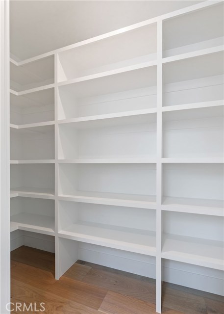 Walk in pantry with built in shelving - so much storage.