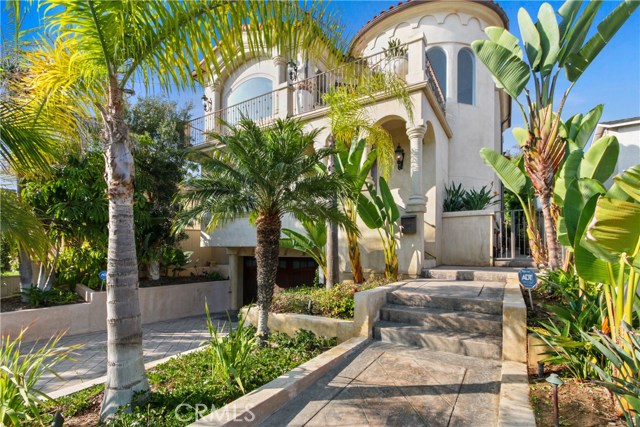 Front entry with tropical landscaping