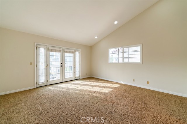 High ceilings, windows, and French doors (onto front balcony) make the master suite a perfect retreat.