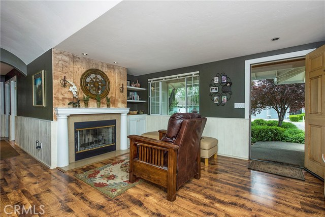 Reading nook in front of wood-burning fireplace