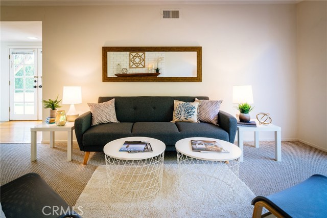 A spacious living room ready for chic decor to compliment the home's character.