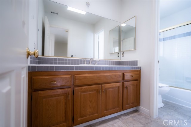 Hall bathroom with separate sink area