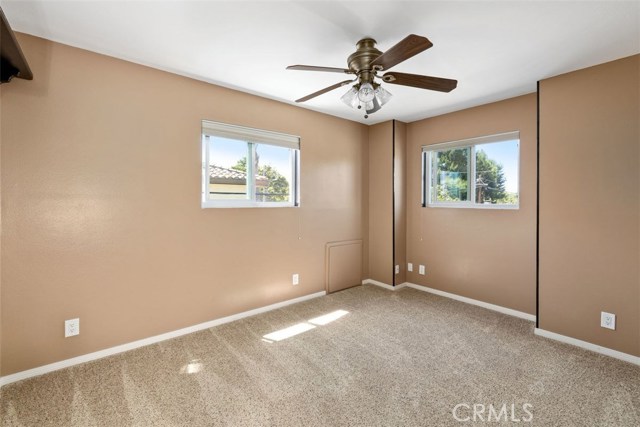 Upstairs bedroom with attic storage access
