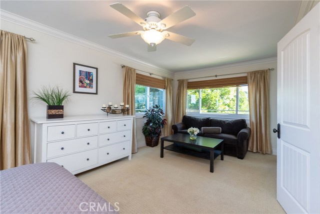 One of the huge upstairs bedrooms, this bedroom has it's own attached full bath and sitting area. The upstairs comprises of 2 HUGE bedrooms, 1 ¾ baths, a nice efficient kitchenette, and discreet entrance that could be closed off.