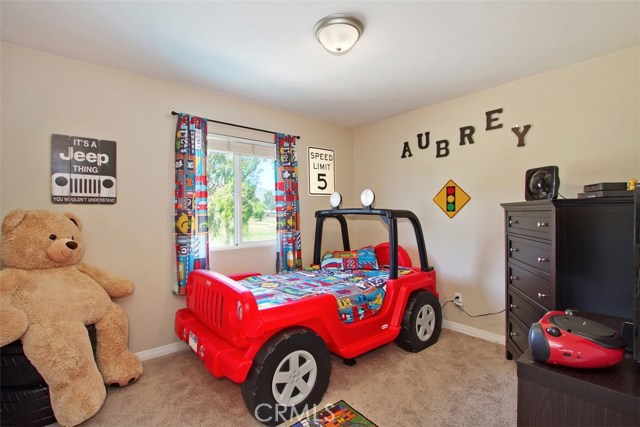 Another upstairs bedroom with golf course view.