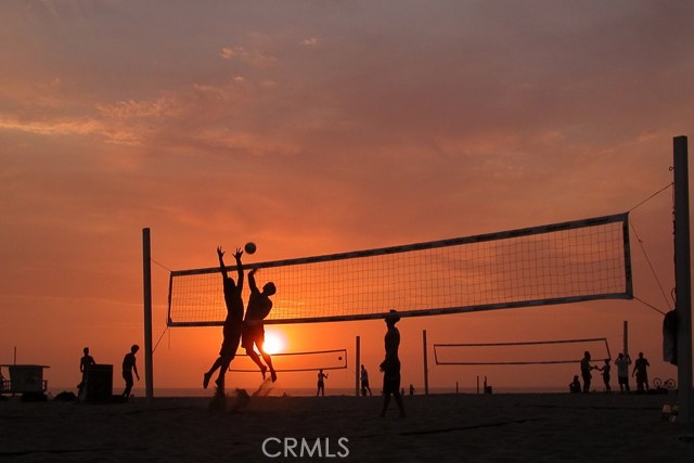 This could be you enjoying beach volleyball and surfing - they are a way of life in Hermosa!