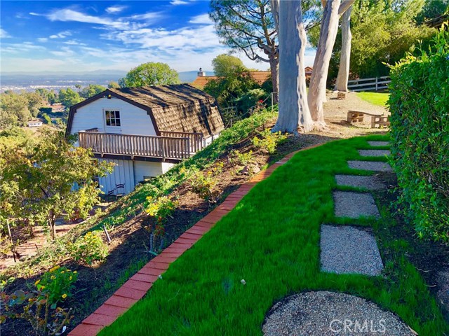 View of The Charming Barn and Walkway to Side Yard.