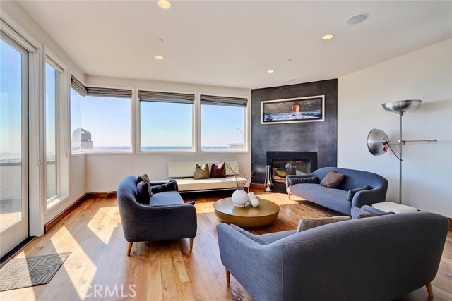 family room with fireplace and ocean views