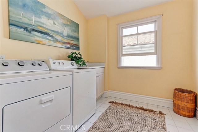 Upstairs separate large laundry room.