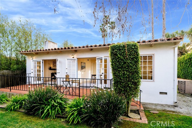 The captivating view of the home looking into the living spaces from the backyard.