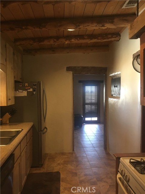 kitchen facing living room and front door