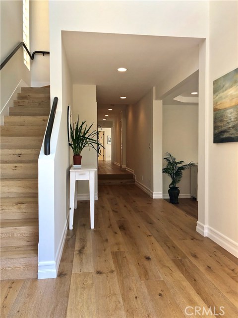 Light and bright 2 story high ceiling entryway w/beautiful wood floors, bedrooms, and open family room.