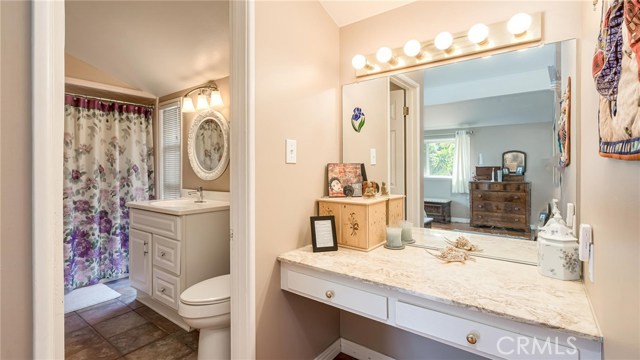 Upstairs master bathroom and dressing table.