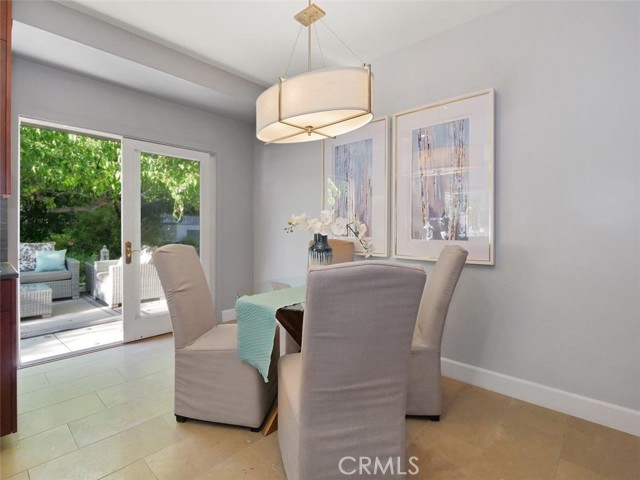 Breakfast area in kitchen with sliding doors open to the lovely backyard