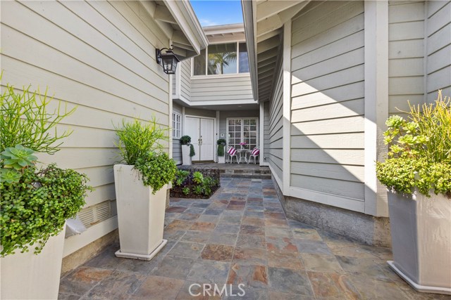 Very special Gated entry with custom stone and Landscaping