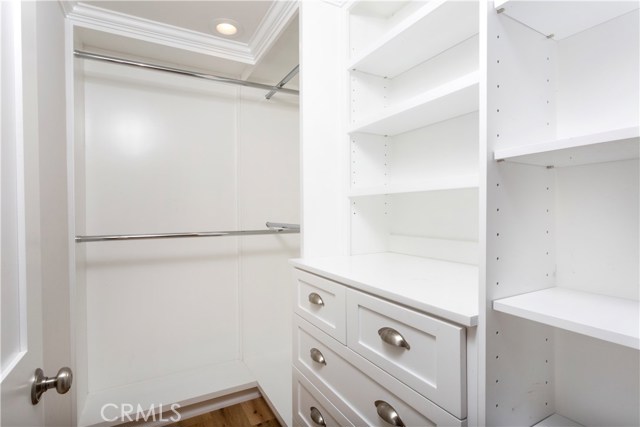 ONE OF MASTER BEDROOM WALK IN CLOSET