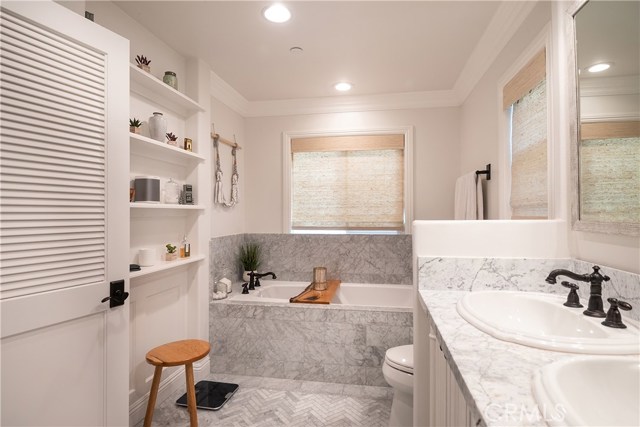 Master bathroom with spa tub, double sinks, walk-in shower.