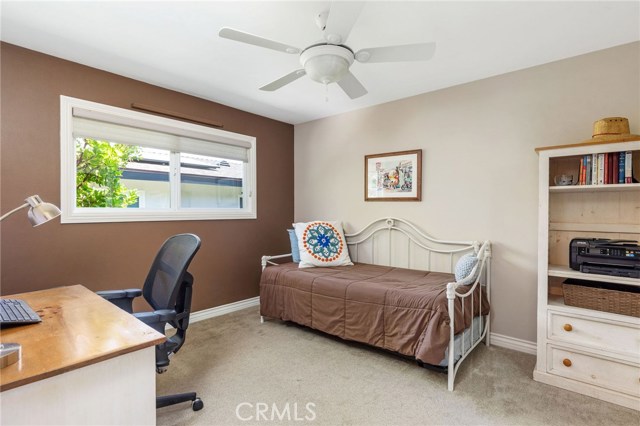 Middle bedroom has good sized closet, big window and ceiling fan.