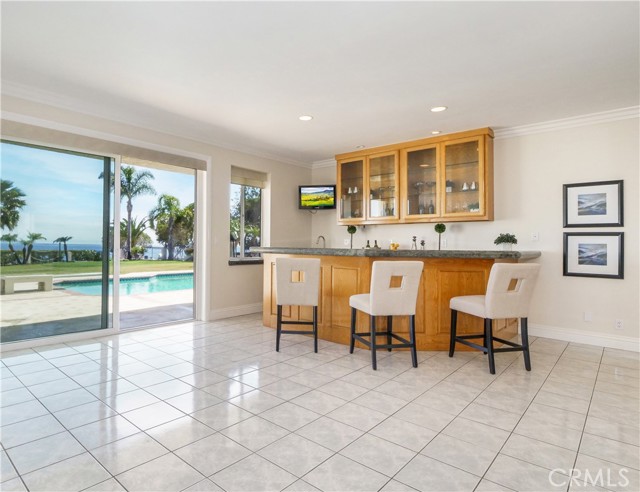 Game Room Overlooks Backyard and Pool