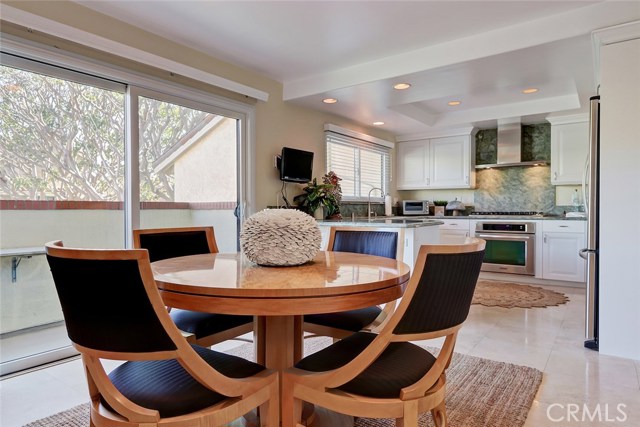 The open floor plan from the breakfast nook to the kitchen and balcony make this a perfect place for family and friends to gather!
