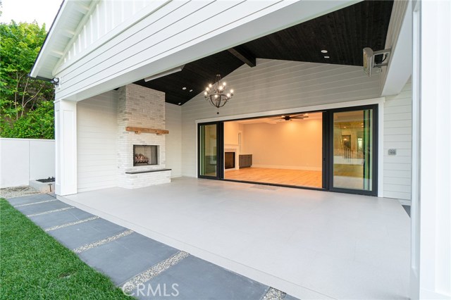 View of covered patio from backyard that leads into family room.