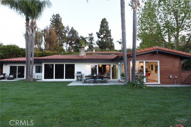 Outstanding rear yard with all new sod and sprinklers, and perfect patios for entertaining and relaxing!
