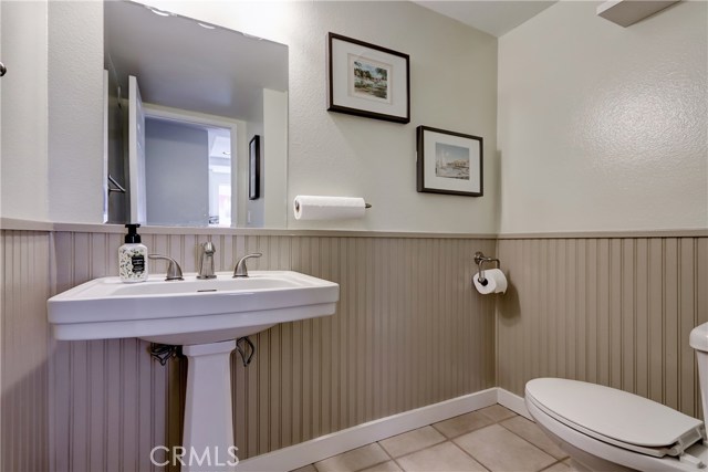 Spacious powder bath located on the first level adjacent to the kitchen area.