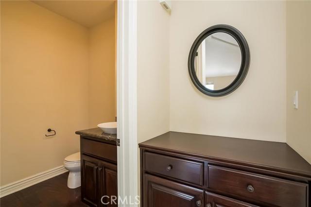 Guest half bath located outside the living room & kitchen.