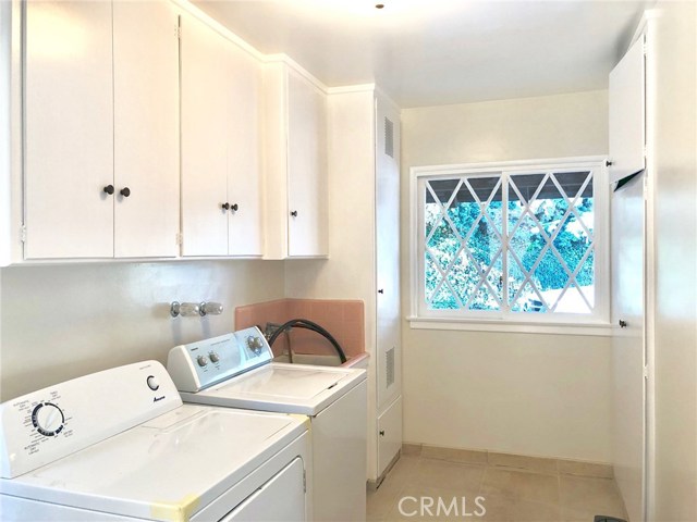 Spacious Laundry Room with Sink and Lots of Storage.