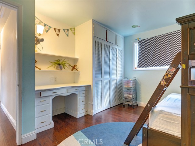 2nd bedroom includes built in desk and deep closet.