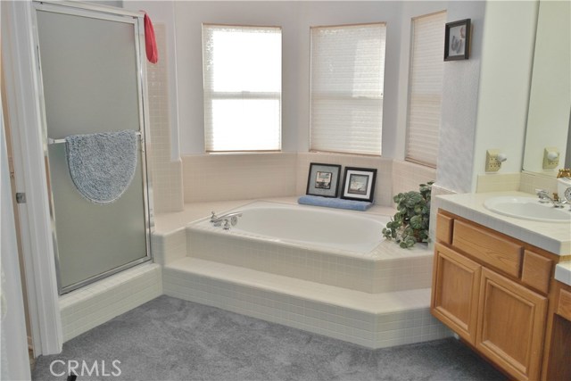 Master Bathroom Also Features Separate Tub And Shower.