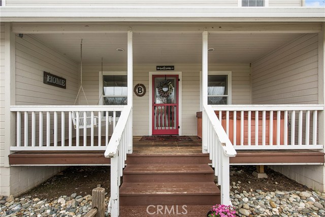 Charming front porch with hot tub