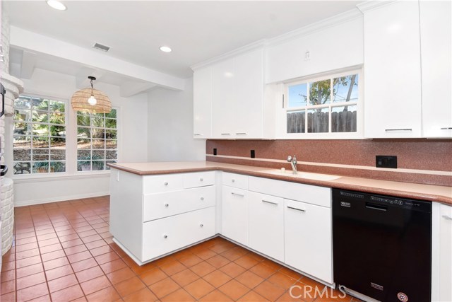 Kitchen and dining room.  Adjacent to the Laundry room.  Also a back door leading to the back yard.