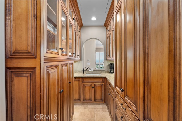 Wet bar includes fridge with ice maker.